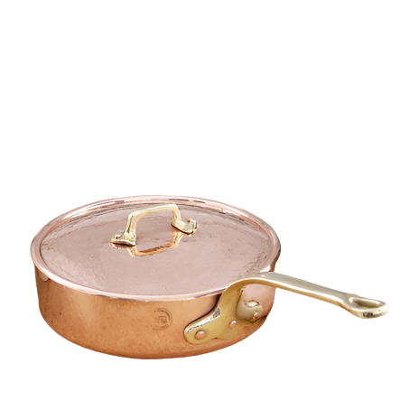 Copper frying pan with gold handle and lid on a white background