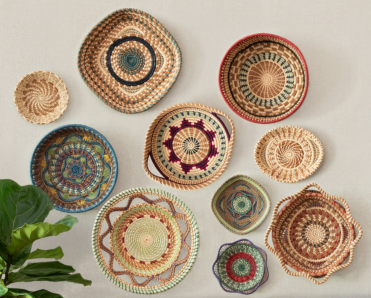 Collection of woven baskets with various patterns on a light background