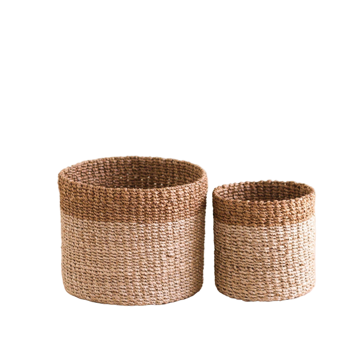 Two woven baskets on a beige background