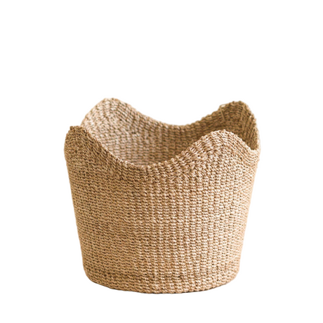 Woven basket made of natural fibers on a white background