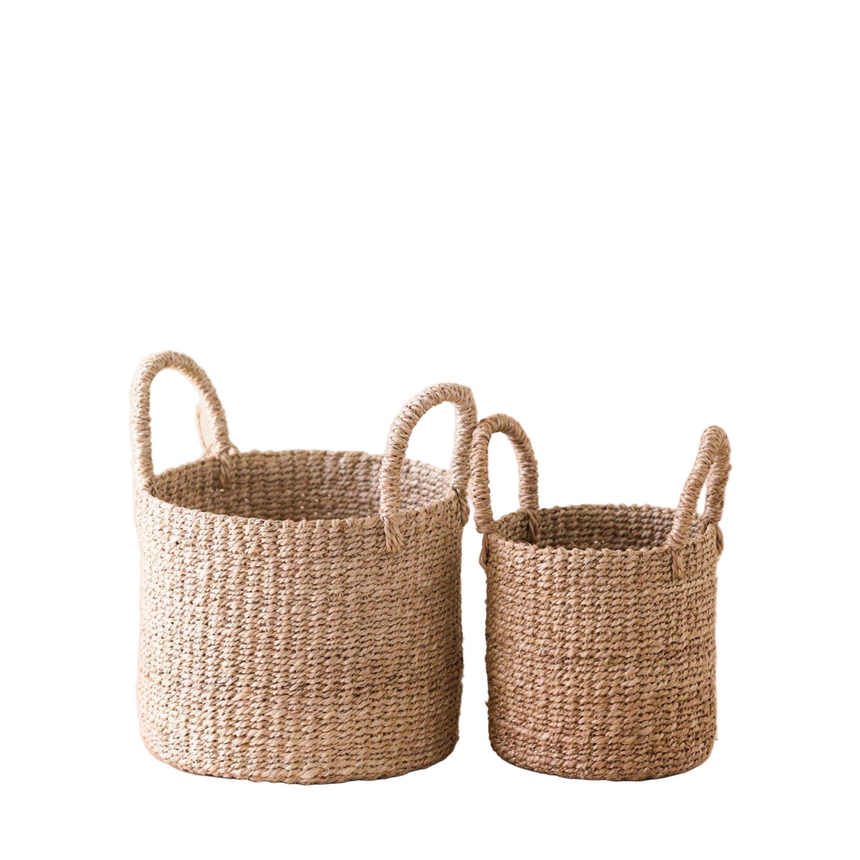 Two woven baskets with handles on a white background