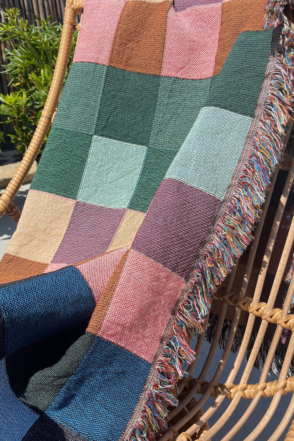Vibrant Gingham Cotton Woven Throw Blanket with a colorful checker pattern.