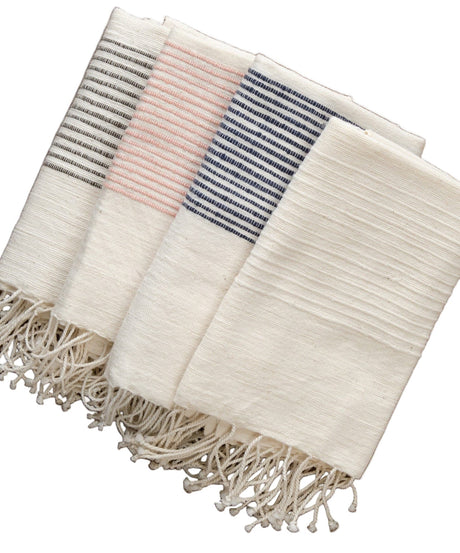 Set of three striped scarves with tassels on a white background