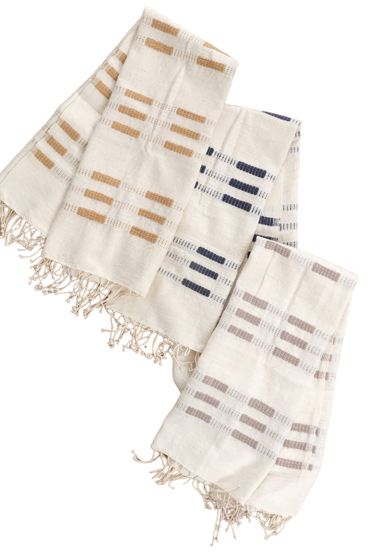 Three woven towels with striped patterns on a wooden surface