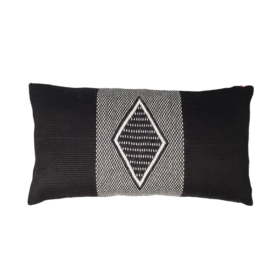 Black and white patterned pillow on a white background
