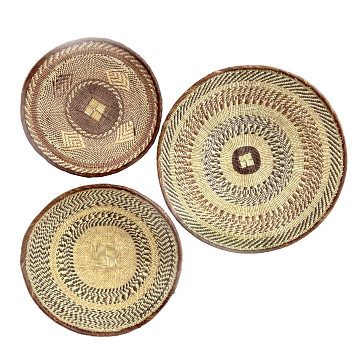 Three woven baskets with circular patterns on a white background