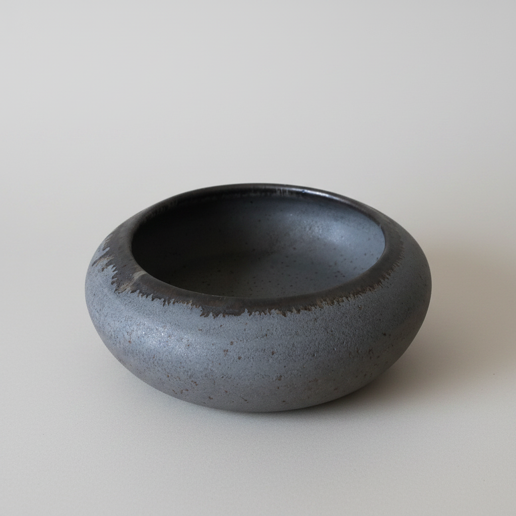 Black ceramic bowl on a white background