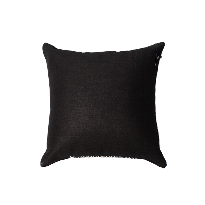 Black pillow on a light gray background