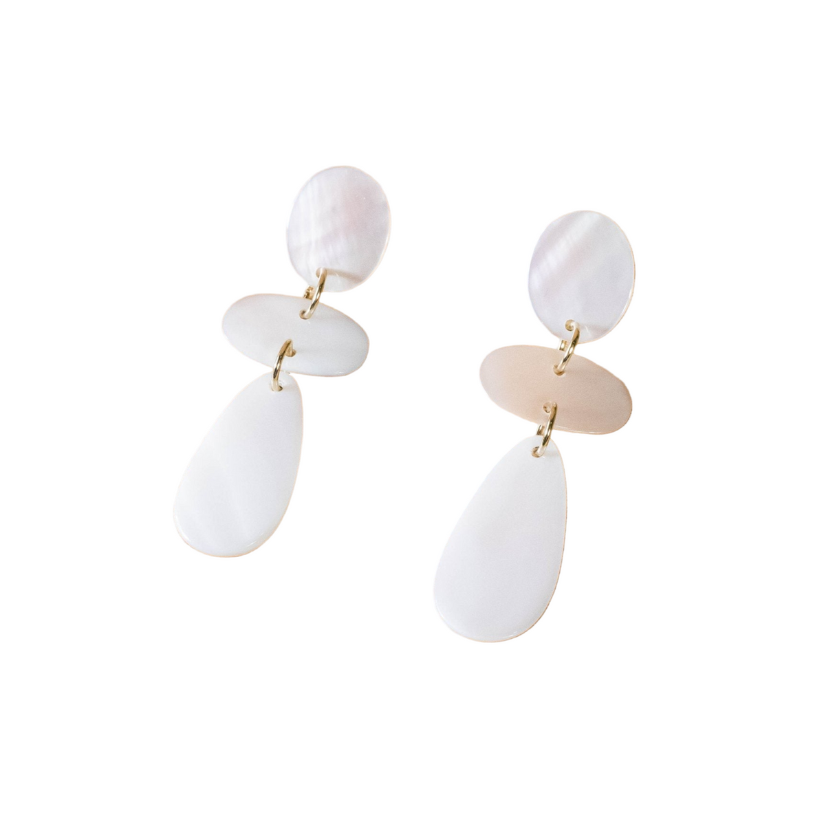 Pair of white and gold earrings on a white background