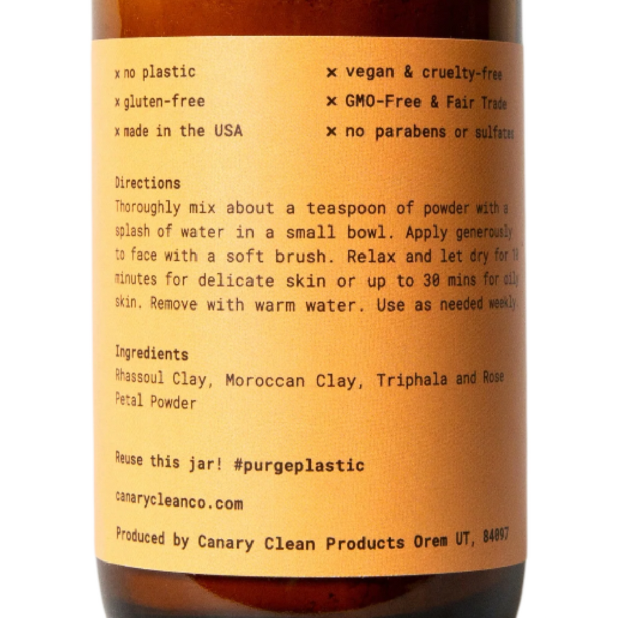 Brown bottle with black cap and yellow label on a white background