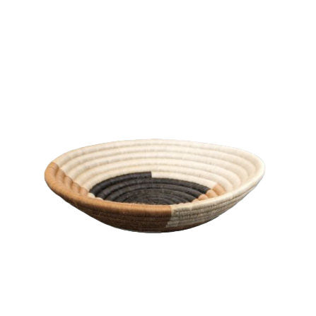 Woven bread basket with three-tone design on a solid background