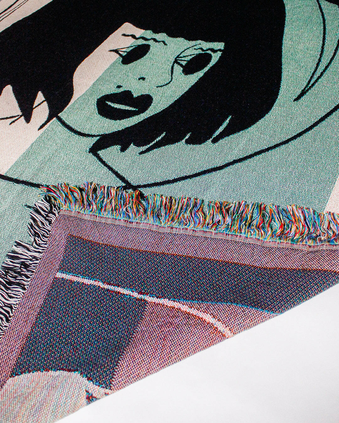 Galactic Muse Alien Cotton Woven Throw Blanket showcasing an alien art design in green, tan, and black.