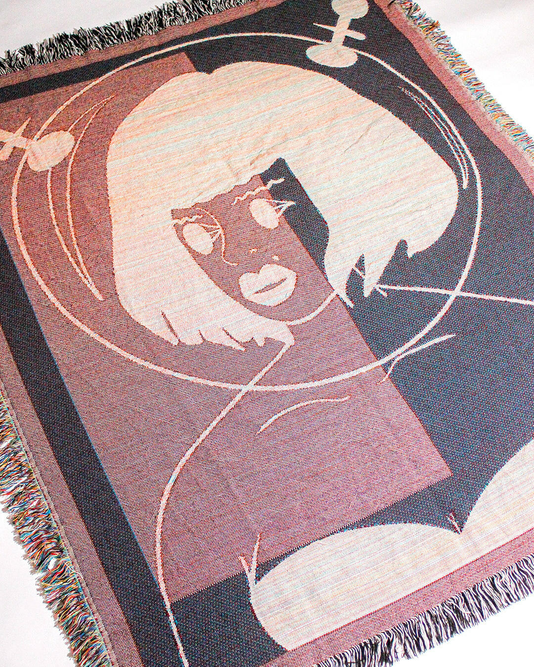 Galactic Muse Alien Cotton Woven Throw Blanket showcasing an alien art design in green, tan, and black.