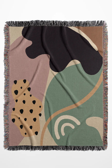 Retro-Futuristic Cotton Woven Throw Blanket in dusty pink, sage green, and cream with fringe edges and modern abstract design