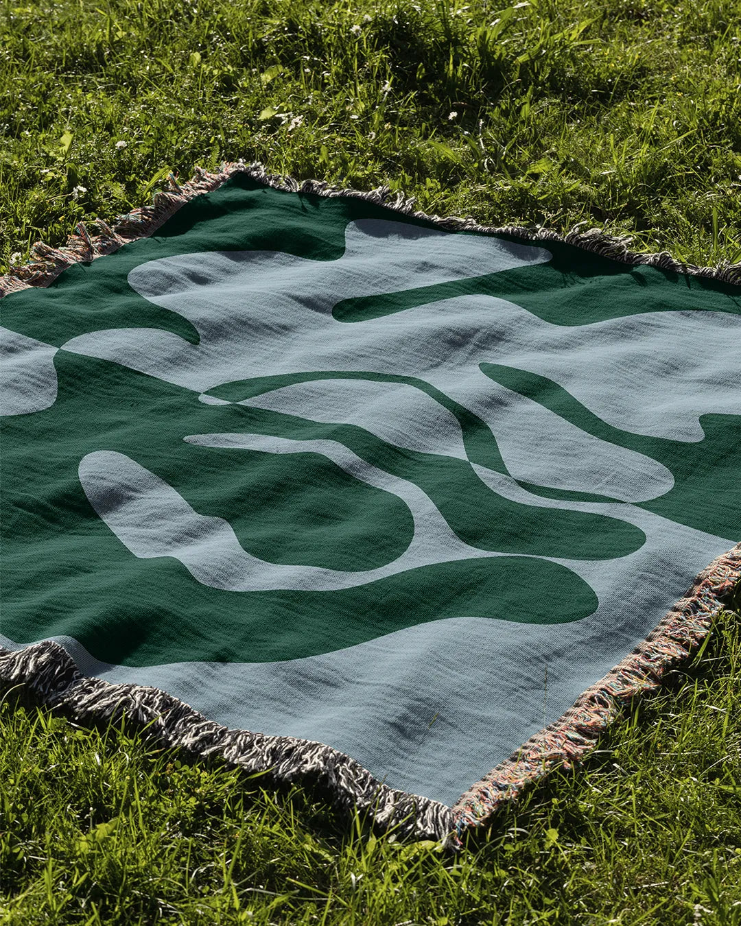 Blue and Green Organic Fusion Cotton Woven Throw Blanket showcasing a two-tone abstract design with organic shapes.