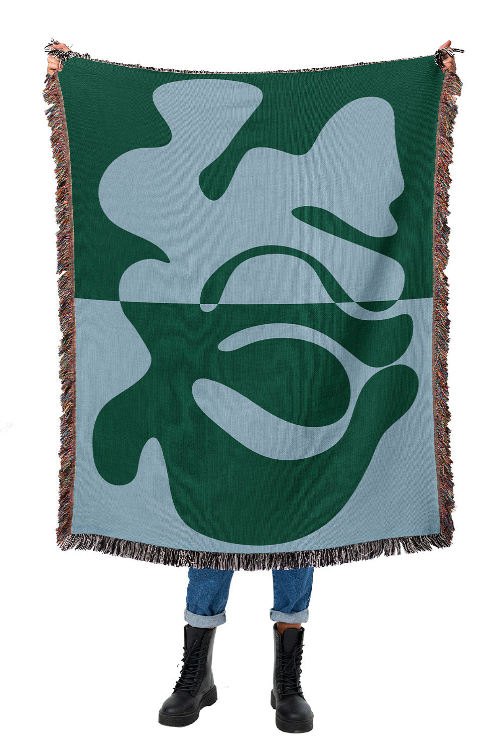 Blue and green woven throw blanket with an abstract organic design and modern aesthetic.