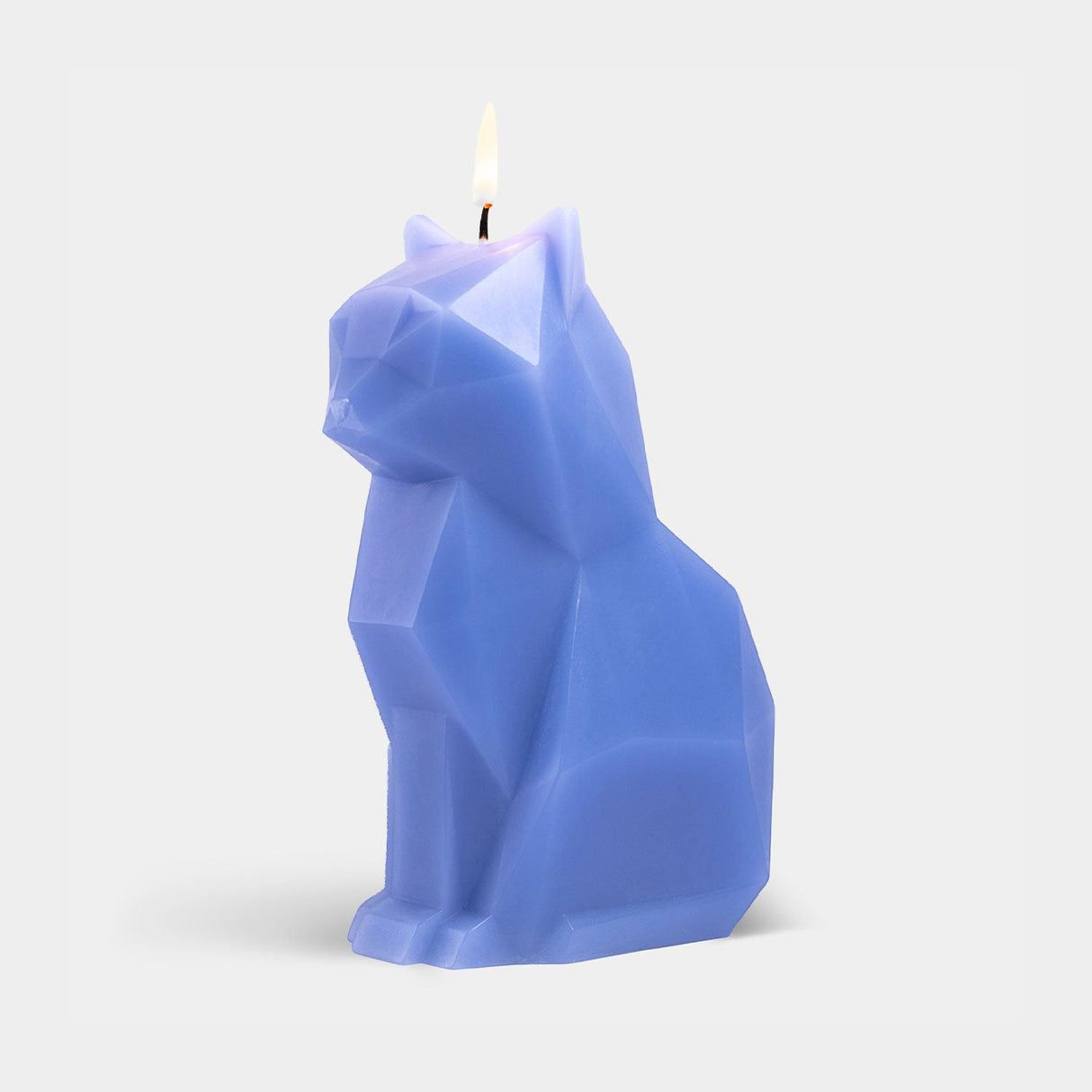 Blue cat-shaped candle on a white background