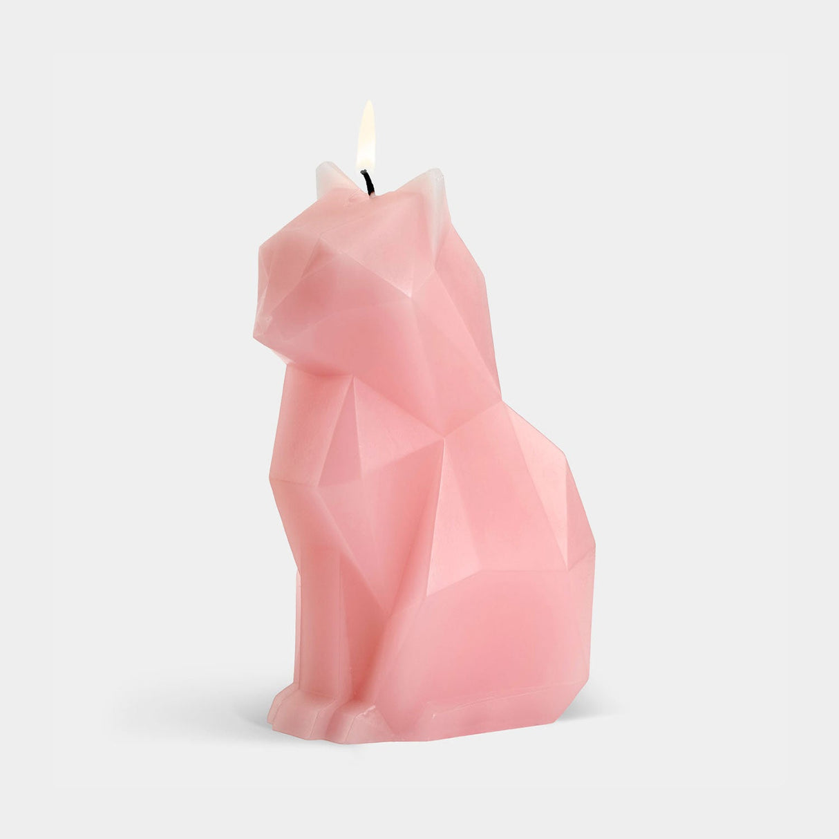 Pink geometric cat-shaped candle on a light gray background