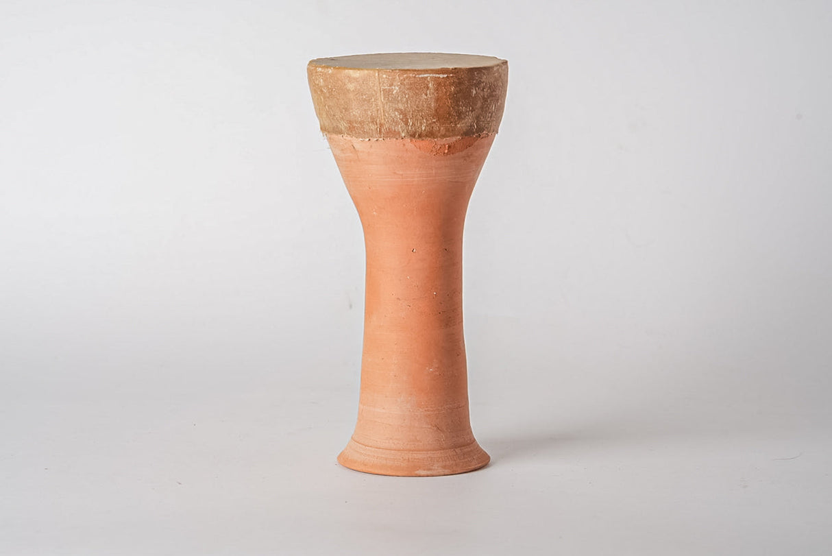 Terracotta drum with a light brown top on a white background