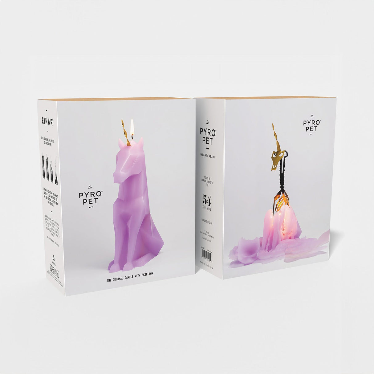 Two boxes of Pyro Pet candles with unicorn and dog designs on a white background