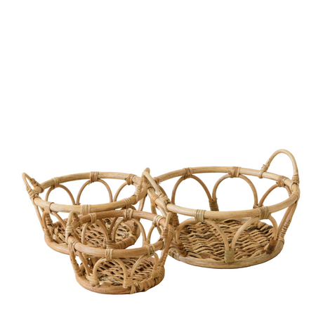 Three woven rattan baskets on a white background