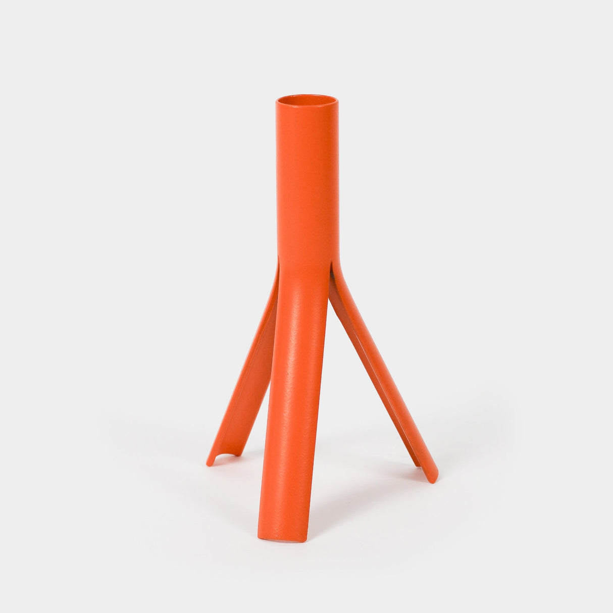 Orange cylindrical object with a tripod-like base on a white background