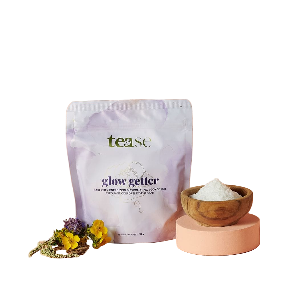 Tease glow getter product packaging with a wooden bowl of powder on a white background