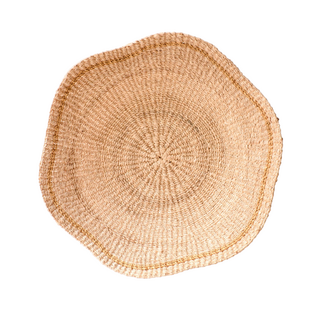Round woven placemat on a white background
