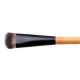 Makeup brush with black ferrule and wooden handle on a white background
