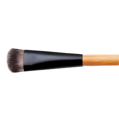 Makeup brush with black ferrule and wooden handle on a white background