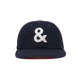 Navy blue cap with a white ampersand symbol on a white background
