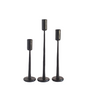 Three black candle holders of varying heights on a white background