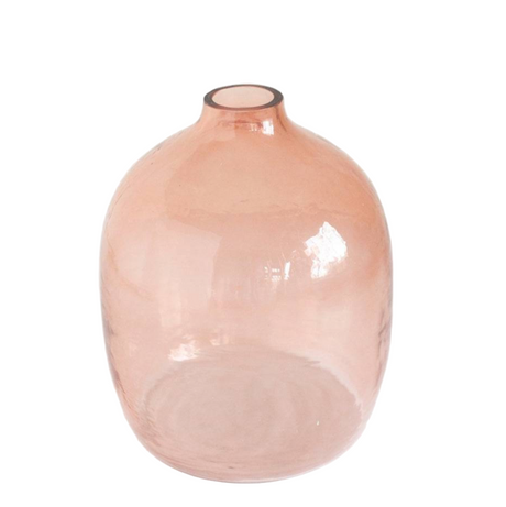 Pink glass vase on a white background