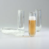 Set of clear glass tumblers on a white background