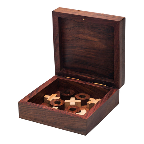 Wooden puzzle box with wooden pieces on a white background