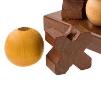 Wooden puzzle with spherical wooden pieces on a white background