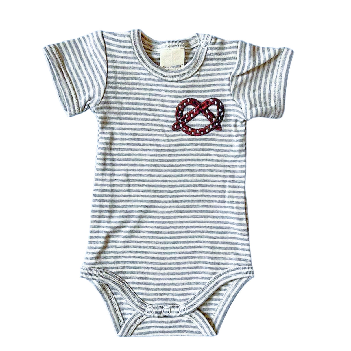 Striped baby onesie with a pretzel design on a white background