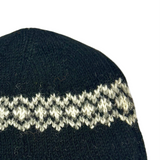Black knit beanie with white pattern and Sherpa logo on a white background