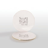 Round ceramic plate with a quote by Maurice Sendak on a white background