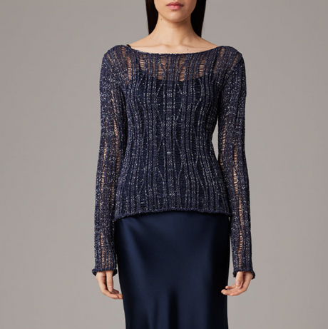 Navy blue textured sweater worn by a model on a gray background
