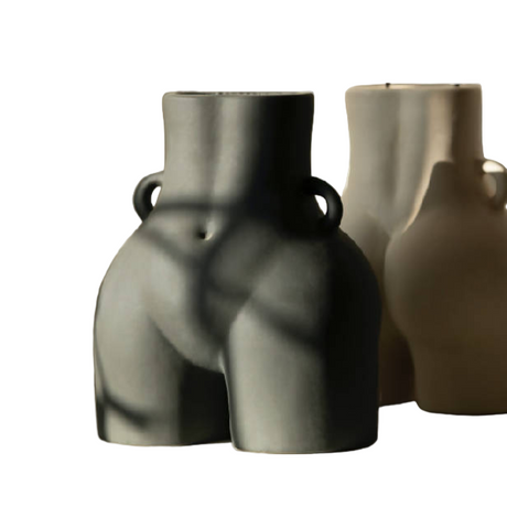 Two ceramic vases in gray and brown on a white background