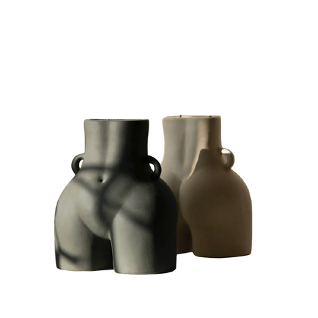 Two ceramic vases with handles on a white background