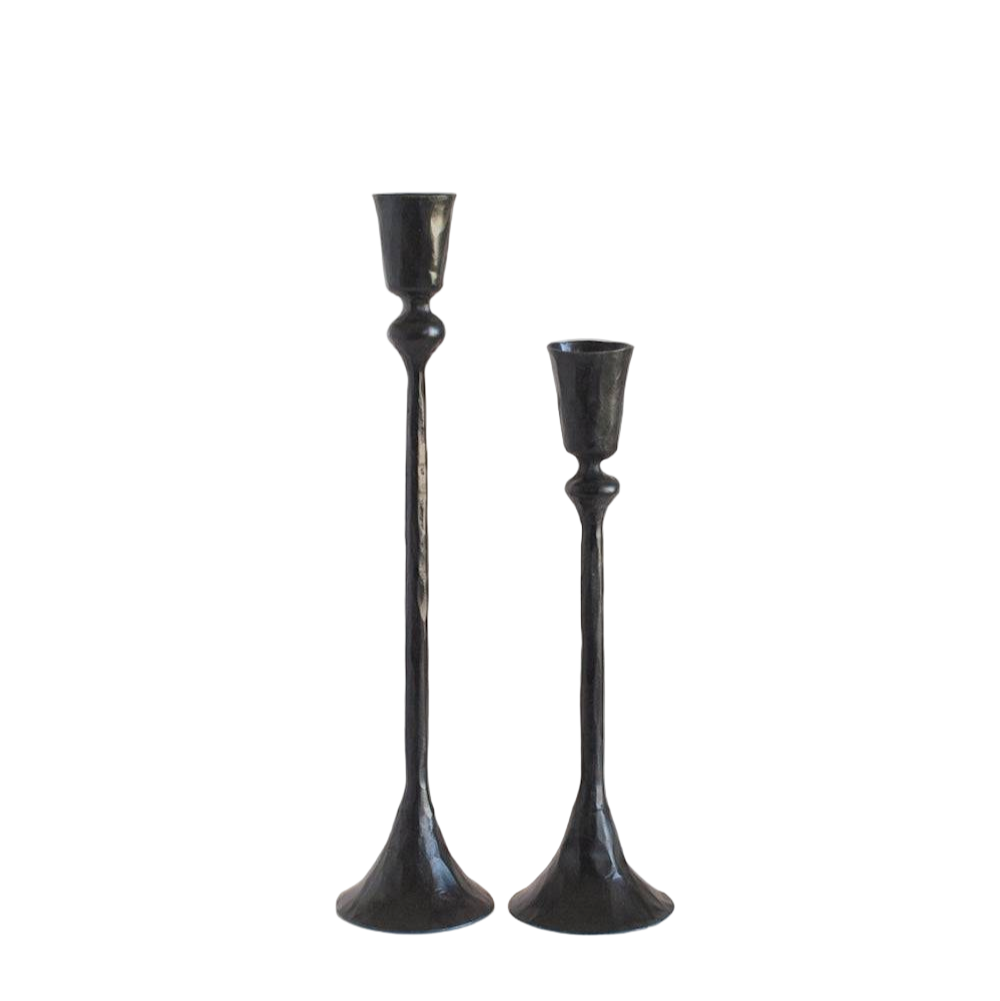 Two black candle holders on a white background