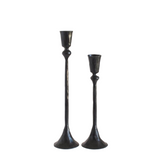 Two black candle holders on a white background