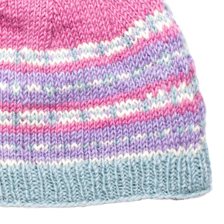Close-up of a knitted beanie with pink, purple, and blue stripes on a white background