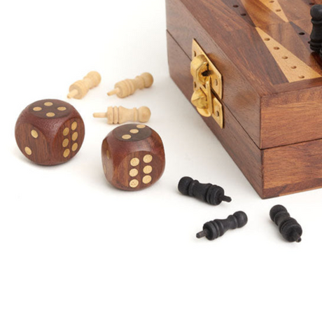 Wooden backgammon set with dice and pieces on a white background