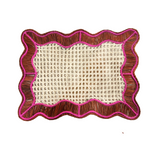 Decorative mat with wicker texture and brown and pink border on a white background