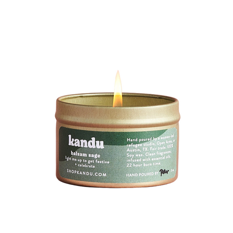 Kandu candle with a green label on a pink background