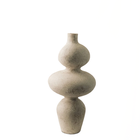 Decorative vase with a textured surface on a white background