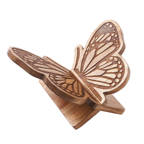 Wooden butterfly-shaped open book holder on a white background